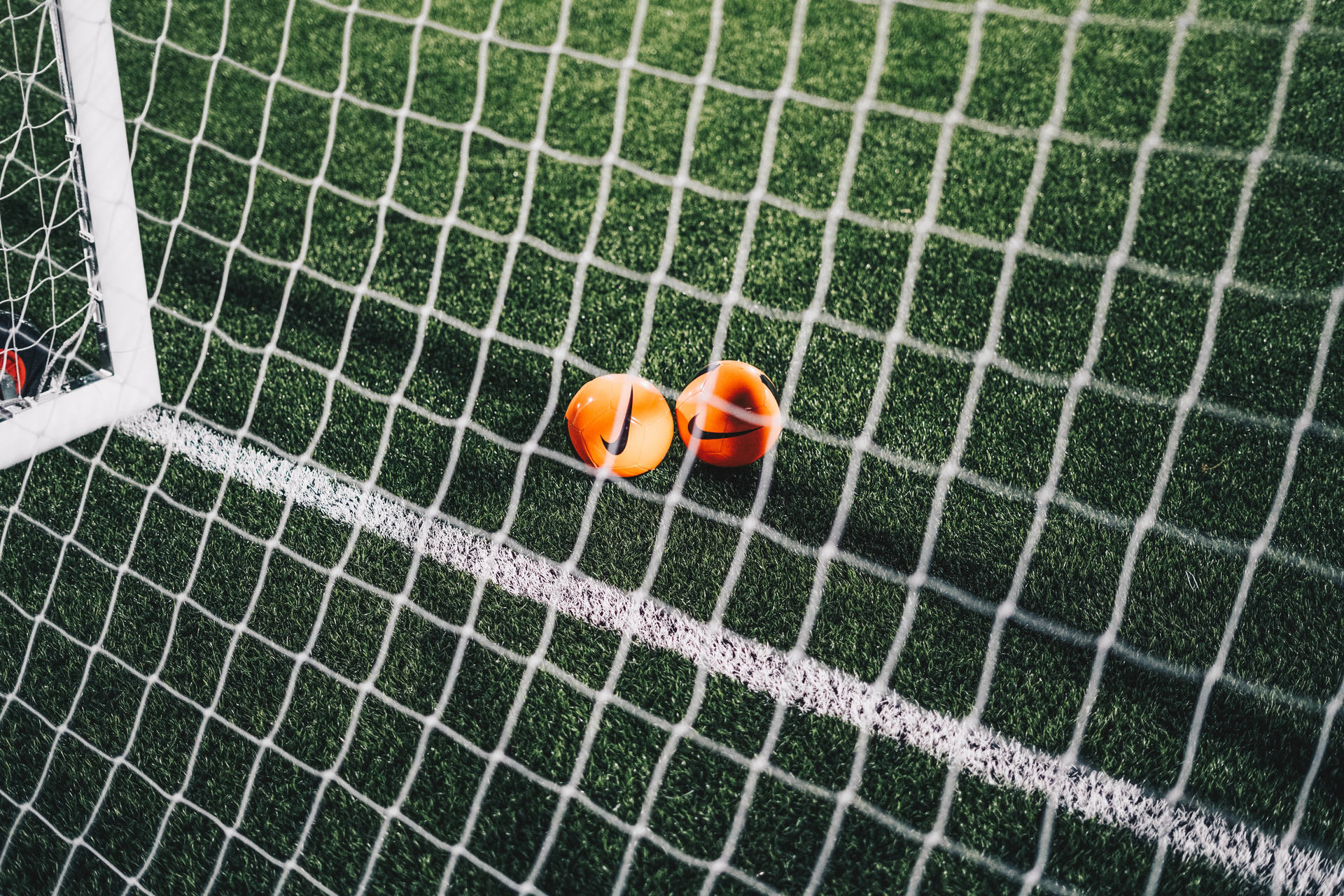 Fondo de escritorio de estadio de fútbol con red.