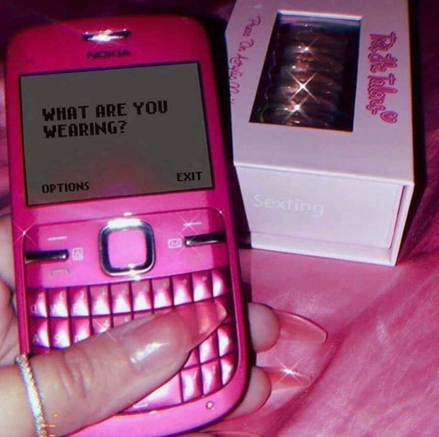 un teléfono celular rosa con un mensaje en él Fondos de pantalla