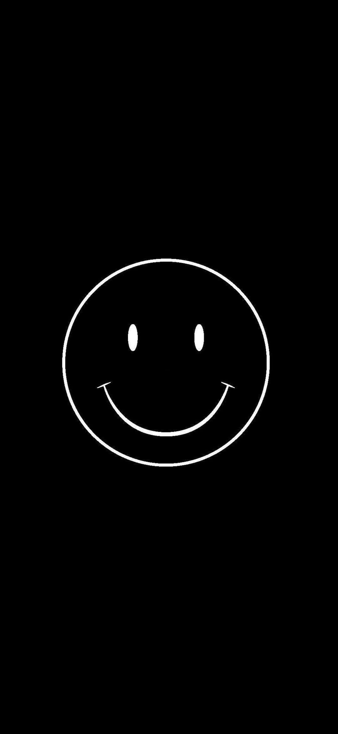 una cara sonriente blanca sobre un fondo negro Fondos de pantalla