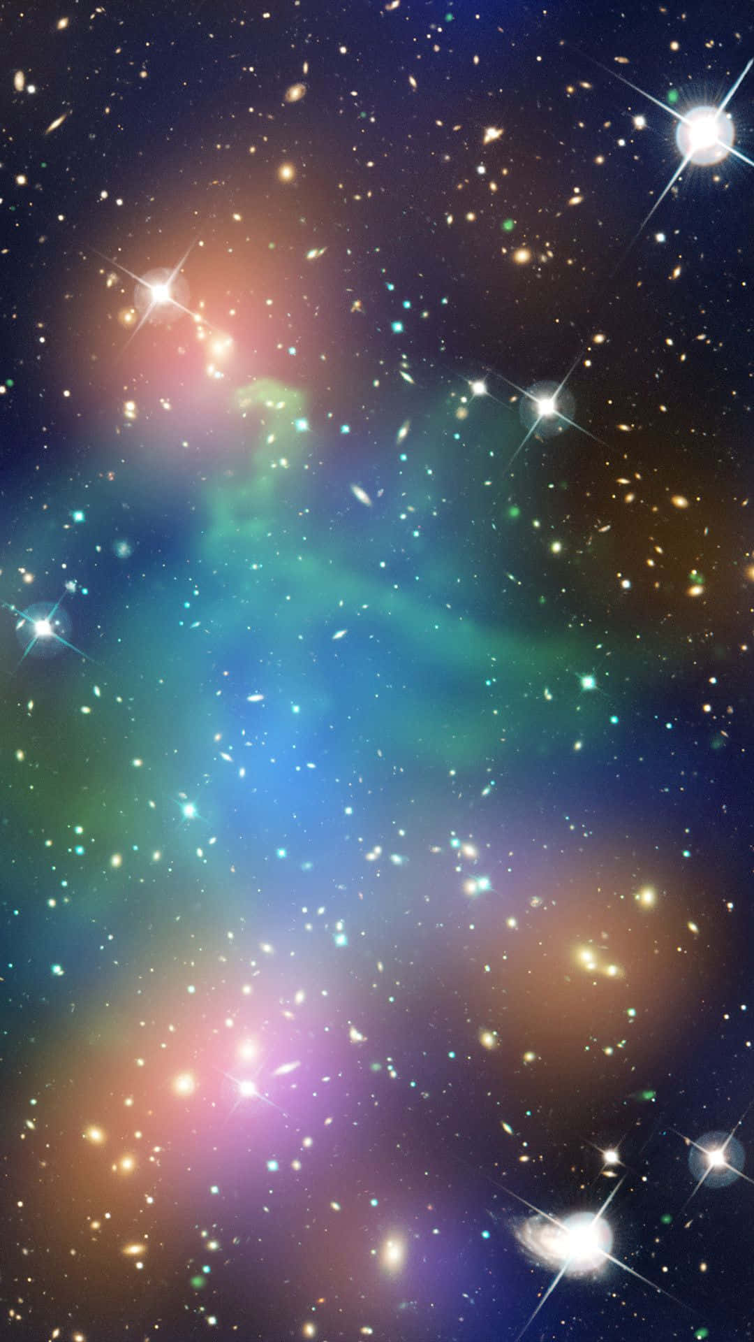 una galaxia colorida con estrellas y una mancha verde Fondos de pantalla