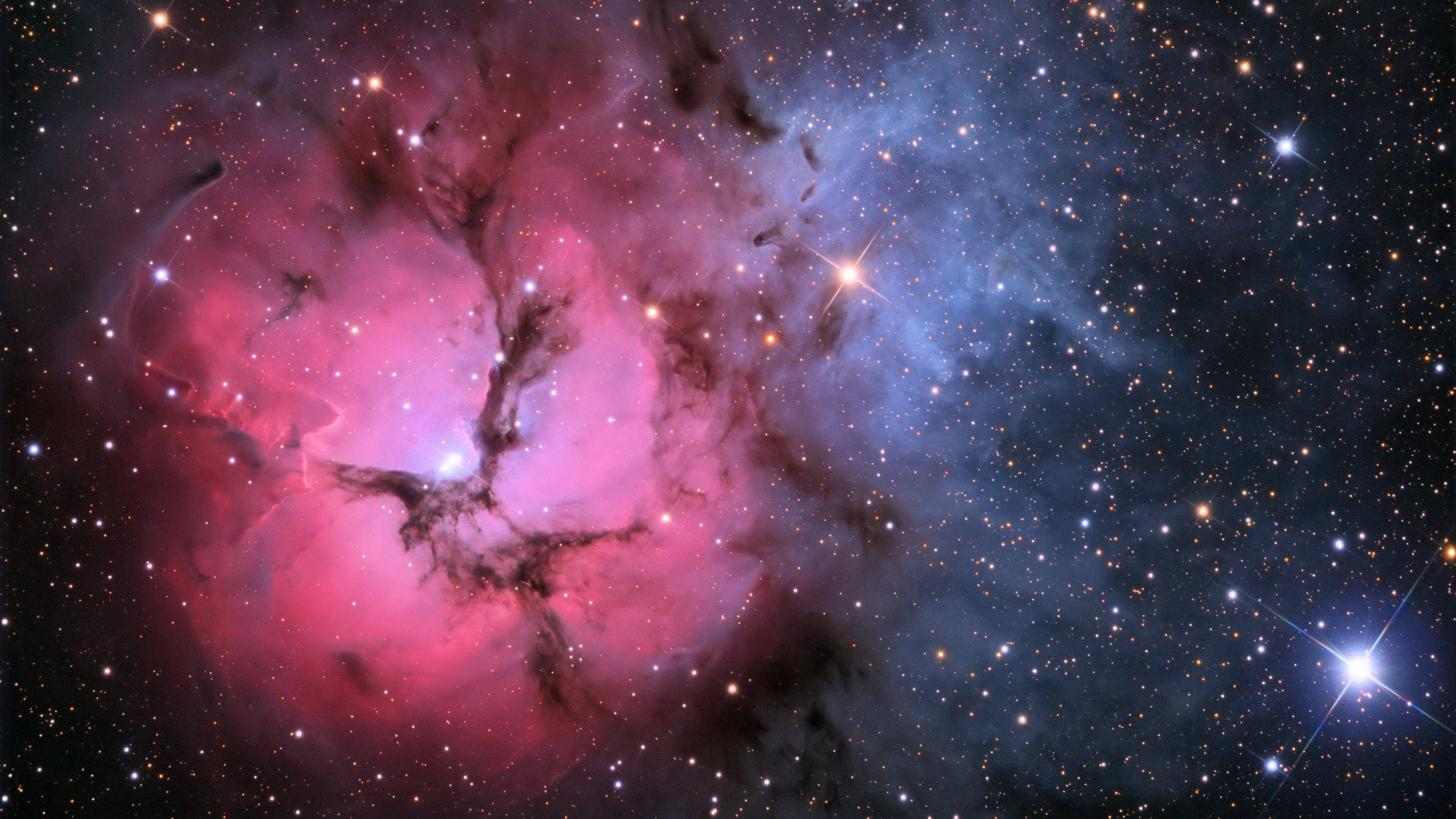 Una hermosa vista de una galaxia rosa y púrpura Fondos de pantalla