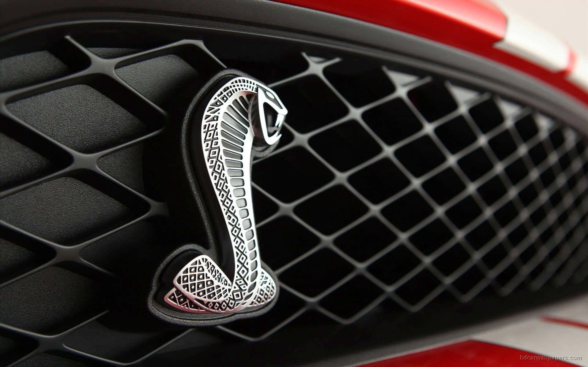 Una impresionante colección de logotipos de autos de lujo sobre un fondo oscuro Fondos de pantalla