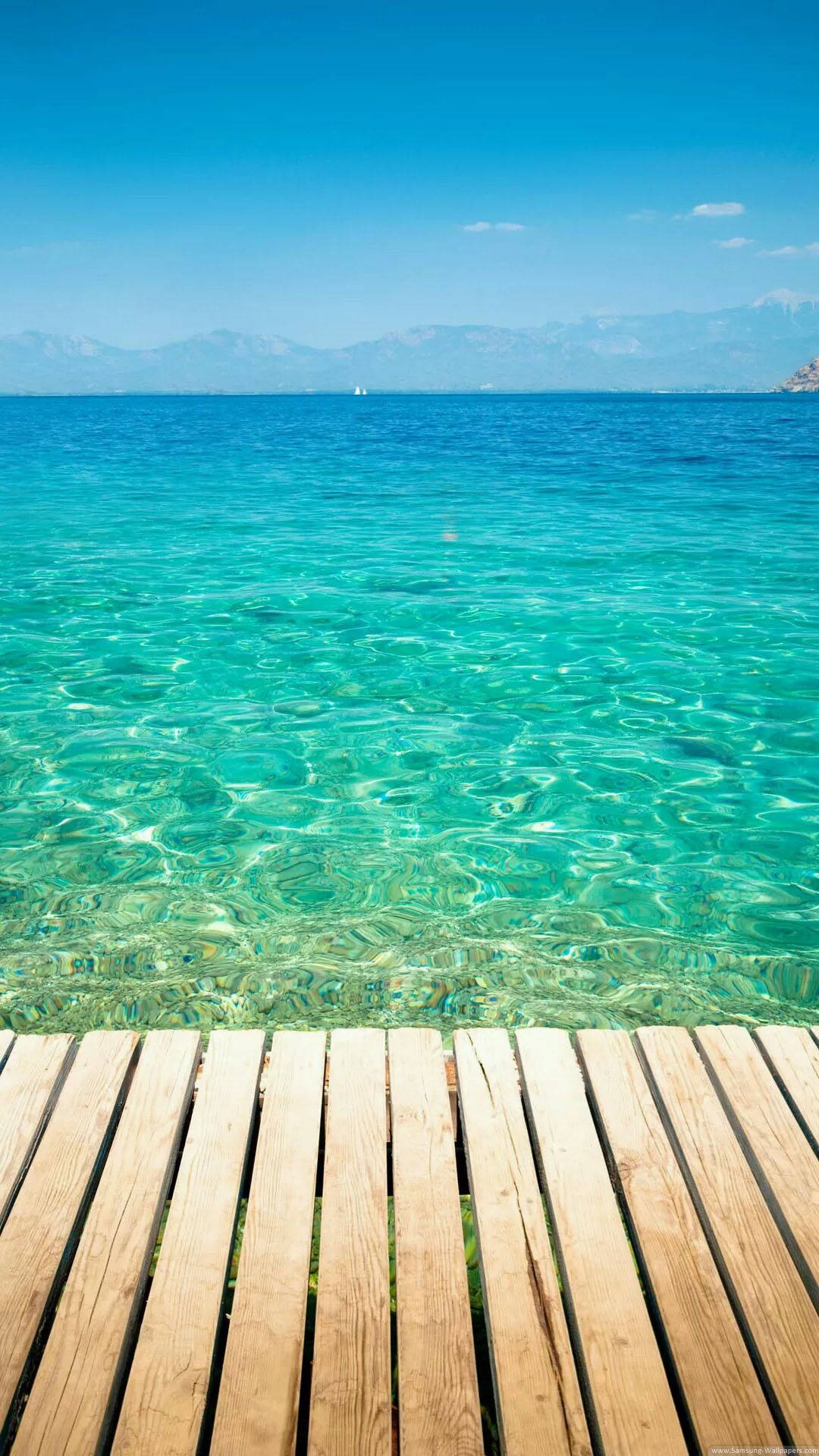 Fondo de pantalla para iPhone de vista al océano desde el malecón