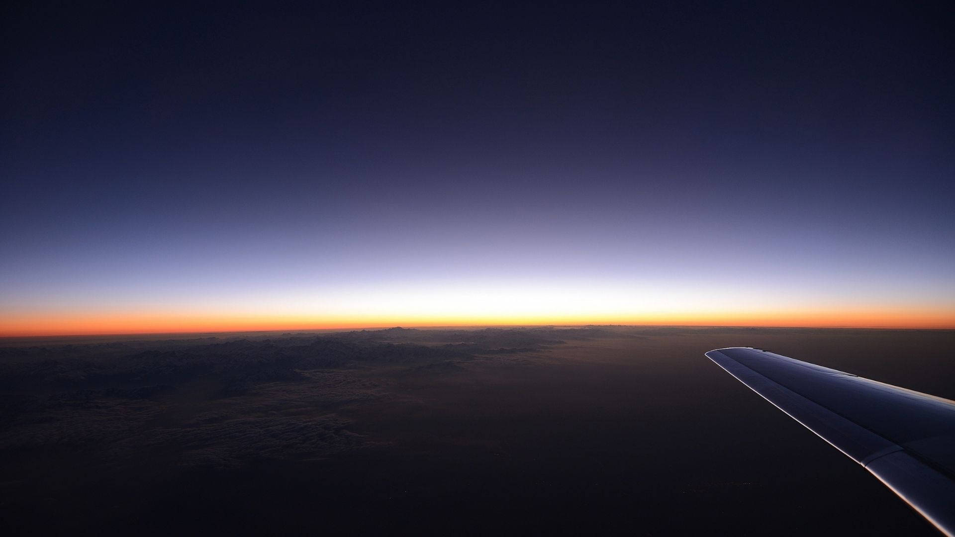 Vista del Cielo al Atardecer desde un Avión Fondos de pantalla