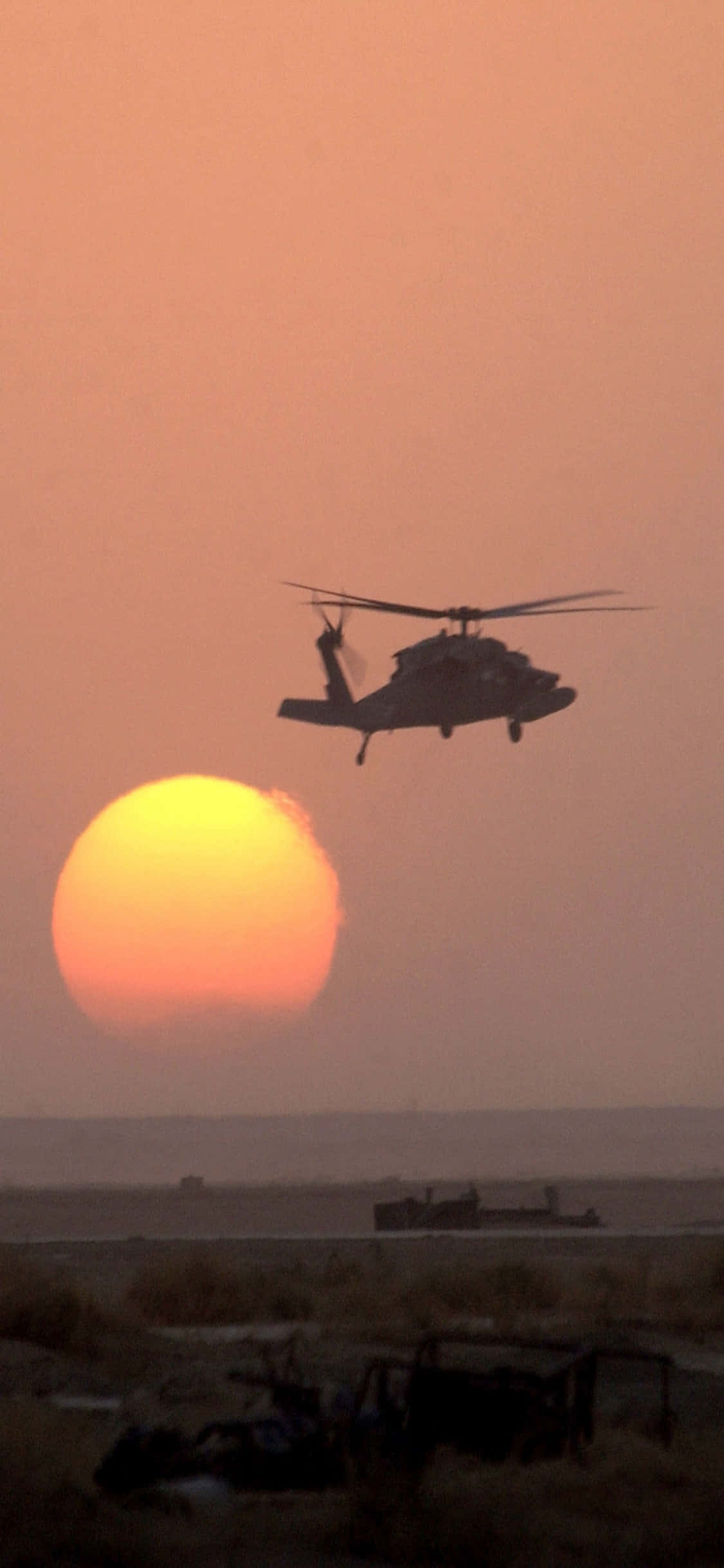 Vista del iPhone Xs y su reflejo en la ventana del helicóptero Fondos de pantalla