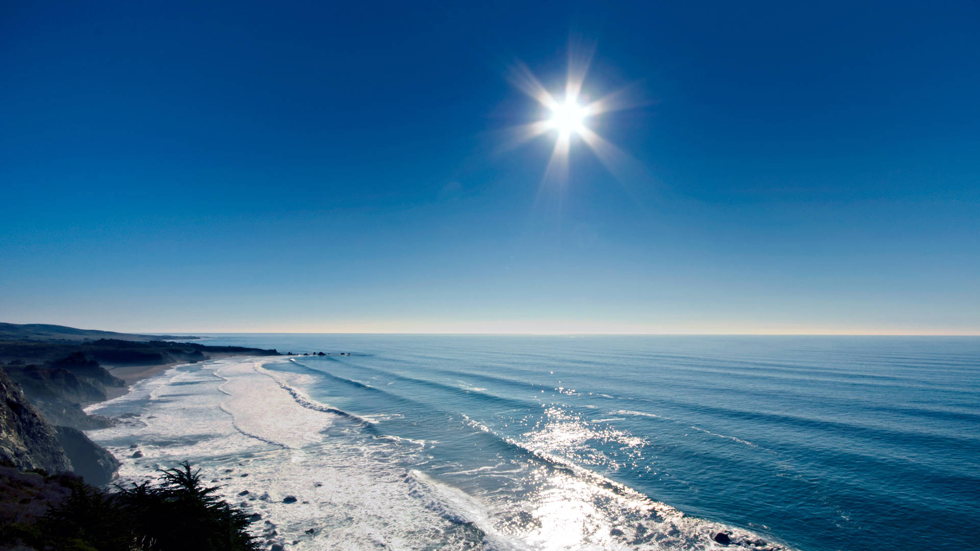 Vista del Océano con Sol Radiante Fondos de pantalla