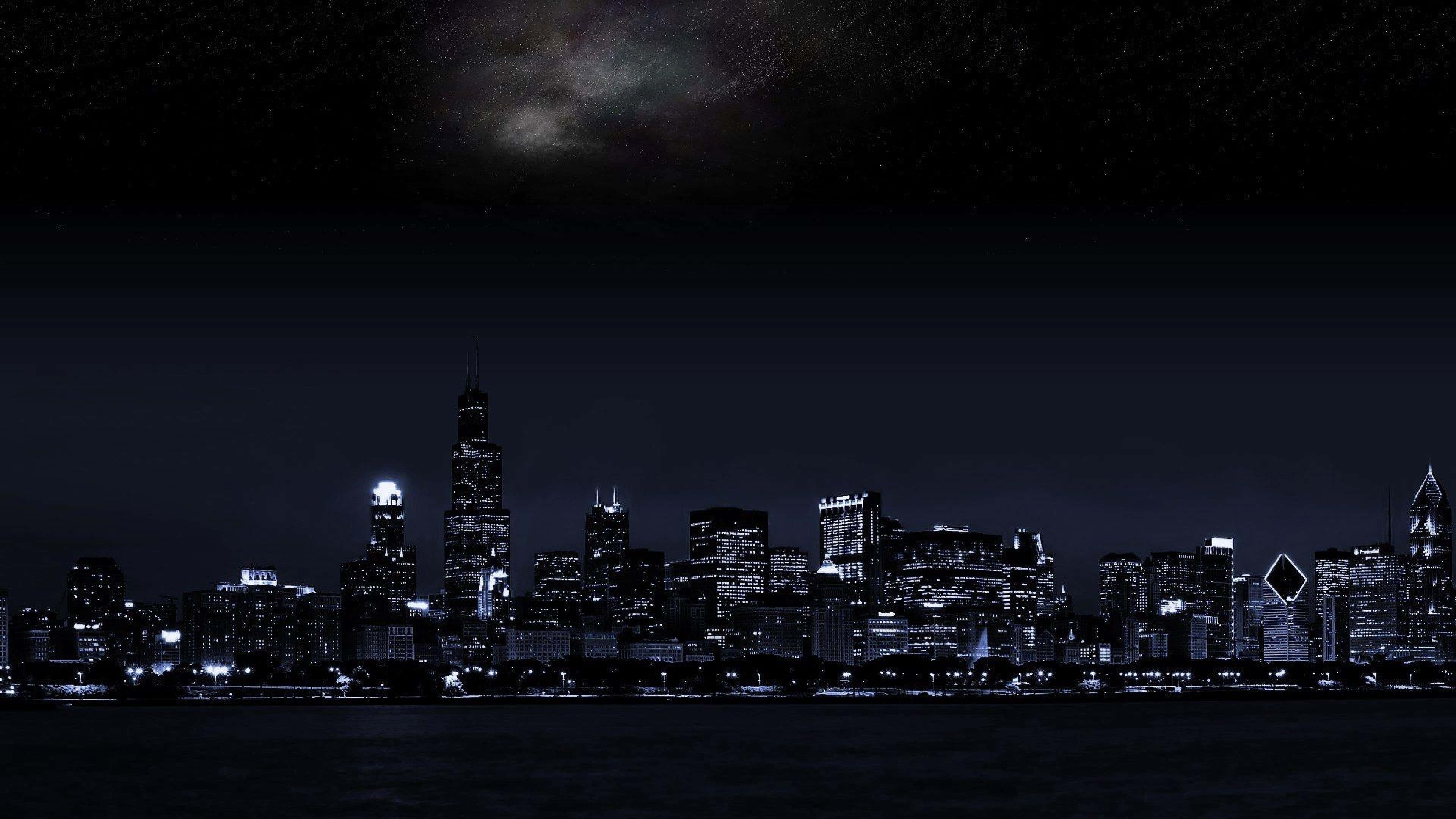 Vista Nocturna Fascinante de una Ciudad Oscura Fondos de pantalla