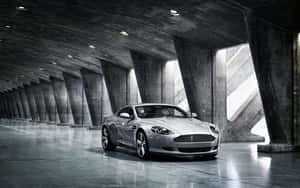 Aston Martin DB9 Navegando por un Paisaje Urbano Escénico — Steam Deck OLED Fondos de pantalla