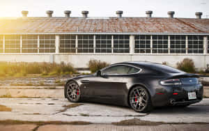 Aston Martin Vanquish en acción en una carretera escénica — Steam Deck OLED Fondos de pantalla
