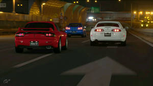 Autos JDM en la carretera de noche