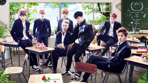 Wallpaper de la boyband BTS posando juntos en la escuela.