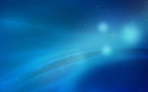 Líneas brillantes azules y puntos resplandecientes como estrellas sobre un fondo azul.