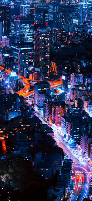 Fondo de pantalla de rascacielos brillantes de noche para la serie iPhone 11. — iPhone 11 Fondos de pantalla