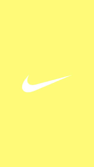 Encantador toque de estética pastel amarillo adorable con el icónico logo de Nike — Aesthetic amarillo pastel Fondos de pantalla
