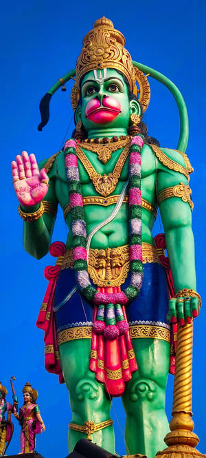 Estatua Gigante Verde del Dios Hanuman — iPhone 16 Pro Max Fondos de pantalla