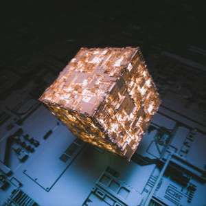 Fondo de pantalla de cubo 3D de piedra luminosa dorada iluminando en la oscuridad