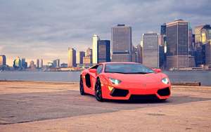 Fondo de pantalla de un Lamborghini Aventador rojo en Brooklyn Bridge Park.