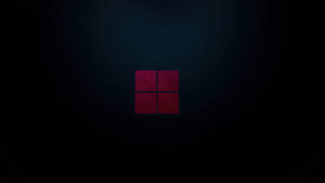 Fondo oscuro de laptop con logotipo de Windows 11