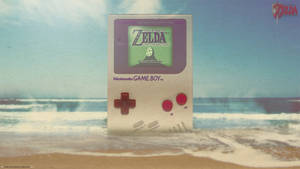 Fondo de pantalla de un gigante Game Boy de Nintendo en la playa