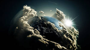 Fondo de pantalla del planeta Tierra con nubes en el espacio exterior oscuro