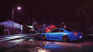 Increíble auto JDM azul brillando bajo el cielo nocturno
