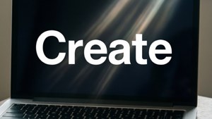 Un fondo de pantalla minimalista para MacBook con la palabra 'Crear' en negrita.