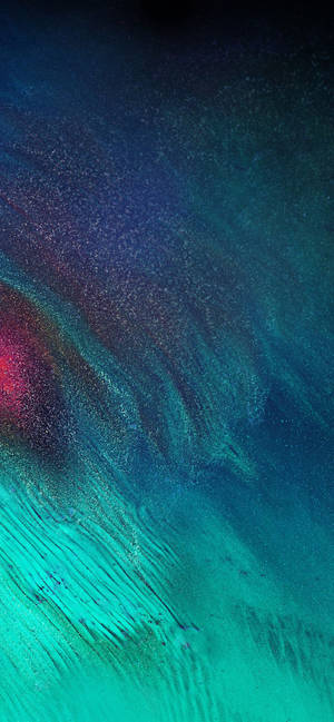 iPhone con destellos abstractos y coloridos — iPhone 16 Pro Max Fondos de pantalla