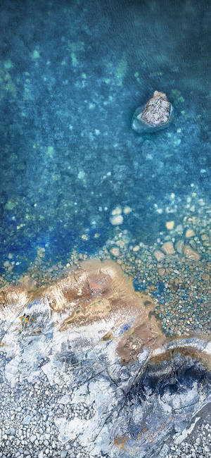 iPhone X original costa rocosa — Galaxy S26 Fondos de pantalla