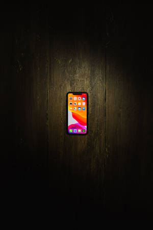 Fondo de pantalla de iPhone Xs Max en piso de madera