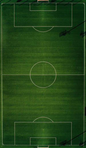 Fondo de pantalla móvil de vista de retrato de campo de fútbol.
