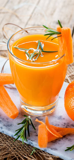 Fondo de pantalla de Jugo de naranja fresco con romero — iPhone 14 Fondos de pantalla