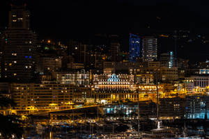 Fondo de pantalla de edificios y luces brillantes de la ciudad de noche