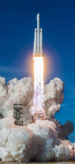 Fondo de pantalla del lanzamiento del Falcon Heavy de SpaceX — iPhone 18 Pro Fondos de pantalla
