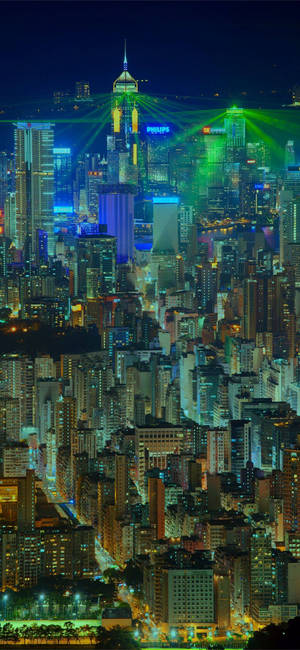 Fondo de pantalla de láseres verdes de Ciudad Ho Chi Minh — iPhone 15 Pro Max Fondos de pantalla