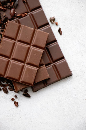 Fondo de pantalla de montón de barras de chocolate — 2:3 Fondos de pantalla