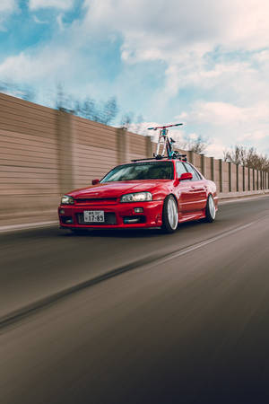 audi a4 rojo en la carretera durante el día