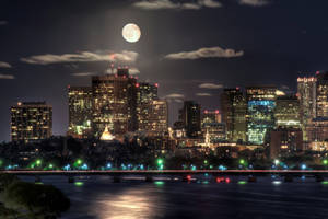 Fondo de pantalla de brillantes rascacielos y puentes de noche