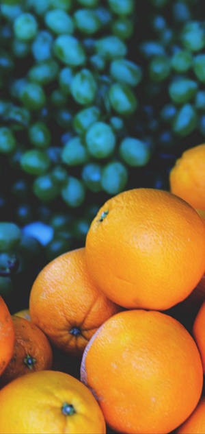 Fondo de pantalla de naranjas y uvas para S10 — iPhone 17 Pro Fondos de pantalla