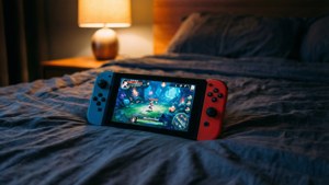 Fondo de pantalla de Fondo de pantalla acogedor nocturno de una Nintendo Switch en una cama, con la pantalla brillando