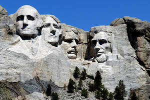 Sol brillando sobre el Monte Rushmore — Cielo Azul Fondos de pantalla
