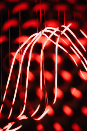 Fondo de pantalla abstracto de luces rojas brillantes