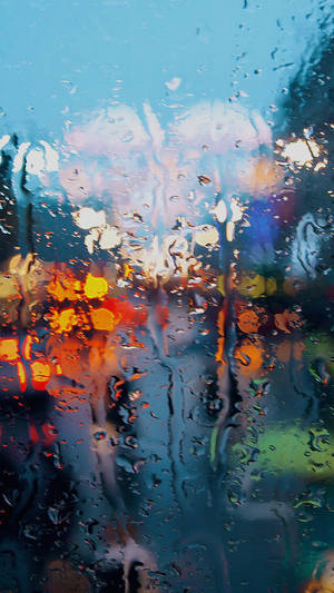 Lluvia deslizándose por la ventana fondo de pantalla iPhone