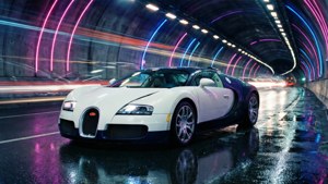 Fondo de pantalla de Un Bugatti Veyron blanco atraviesa a toda velocidad un túnel iluminado con neón, dejando estelas de luz.